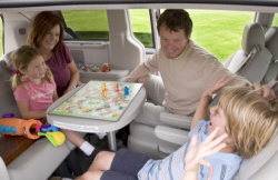 Family using Swivel 'n Go seats in Chrysler minivan